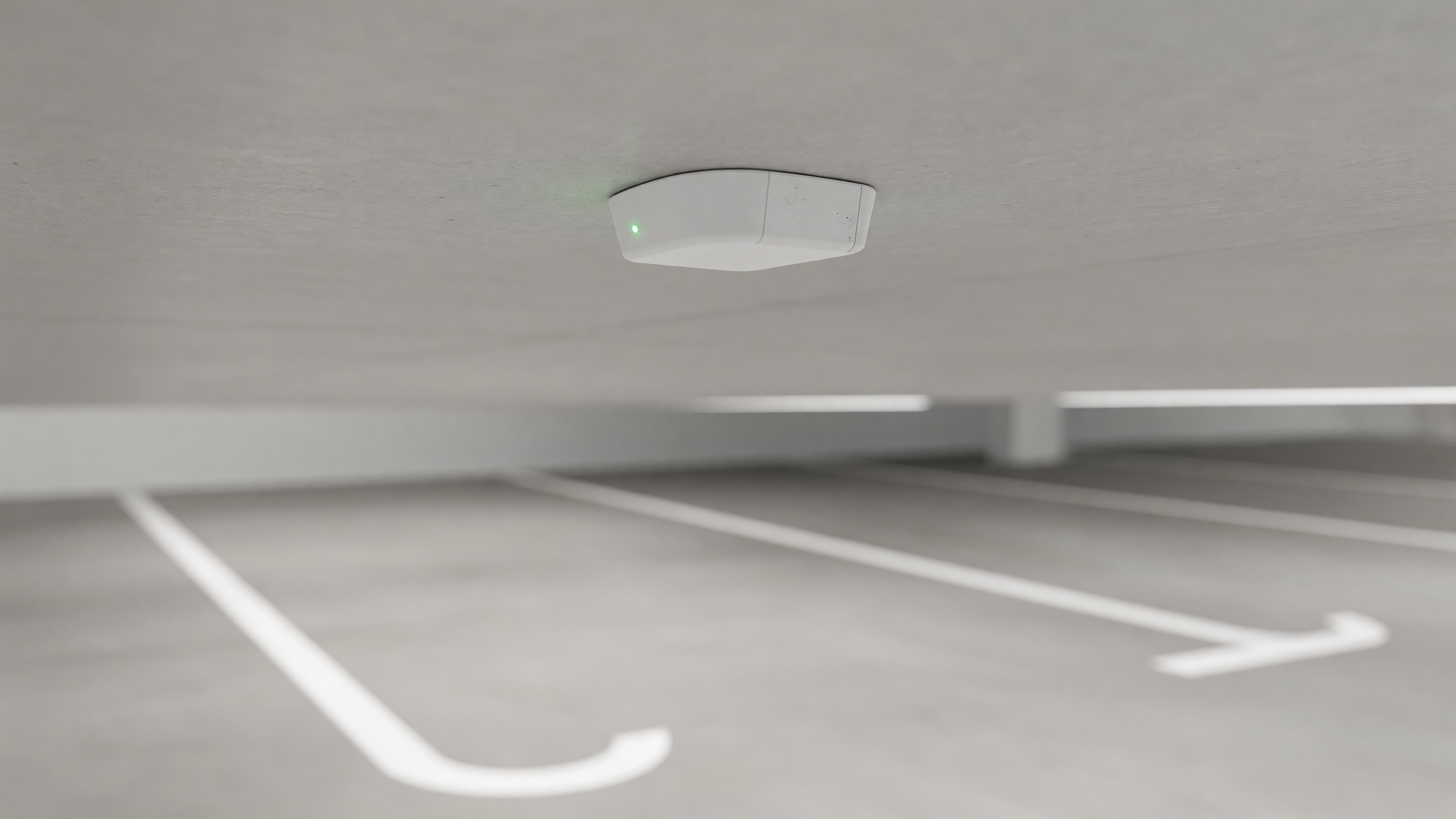 Hardware components of a parking guidance and information system including overhead sensors and LED indicators