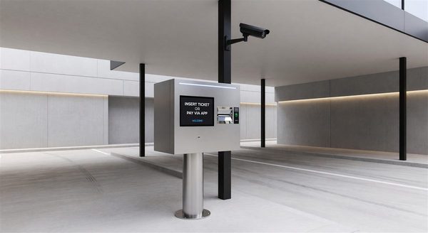 Parking ticket dispenser at a garage entry lane dispensing a thermal ticket